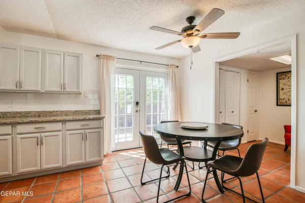 a dining room with furniture and window