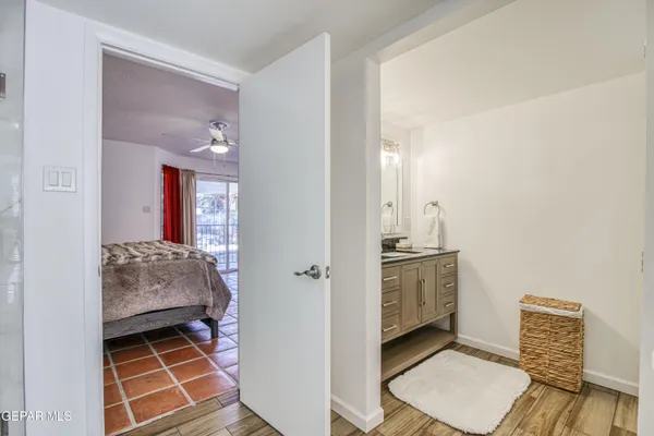 a room with a door open to a room