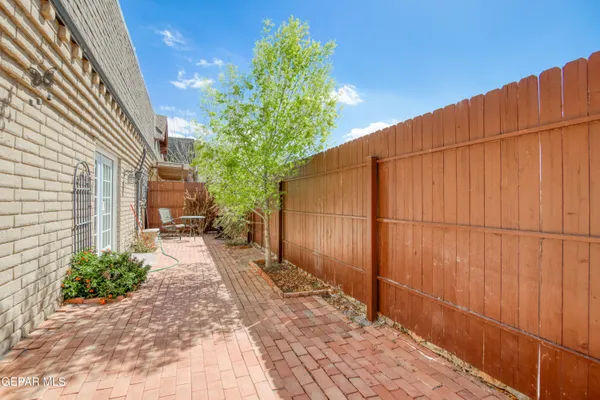 a view of entrance gate with wooden fence