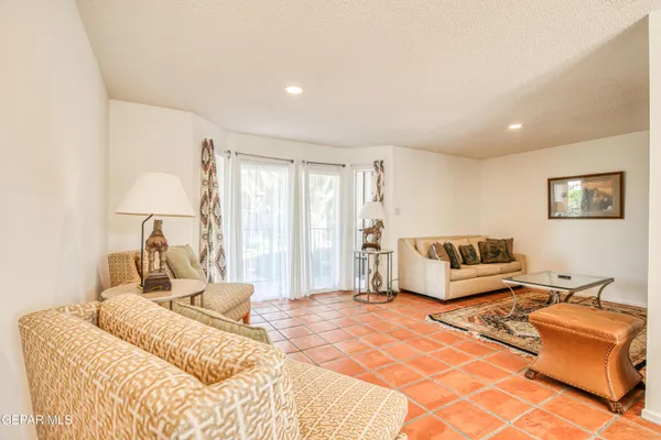 a bedroom with a large bed and a couch