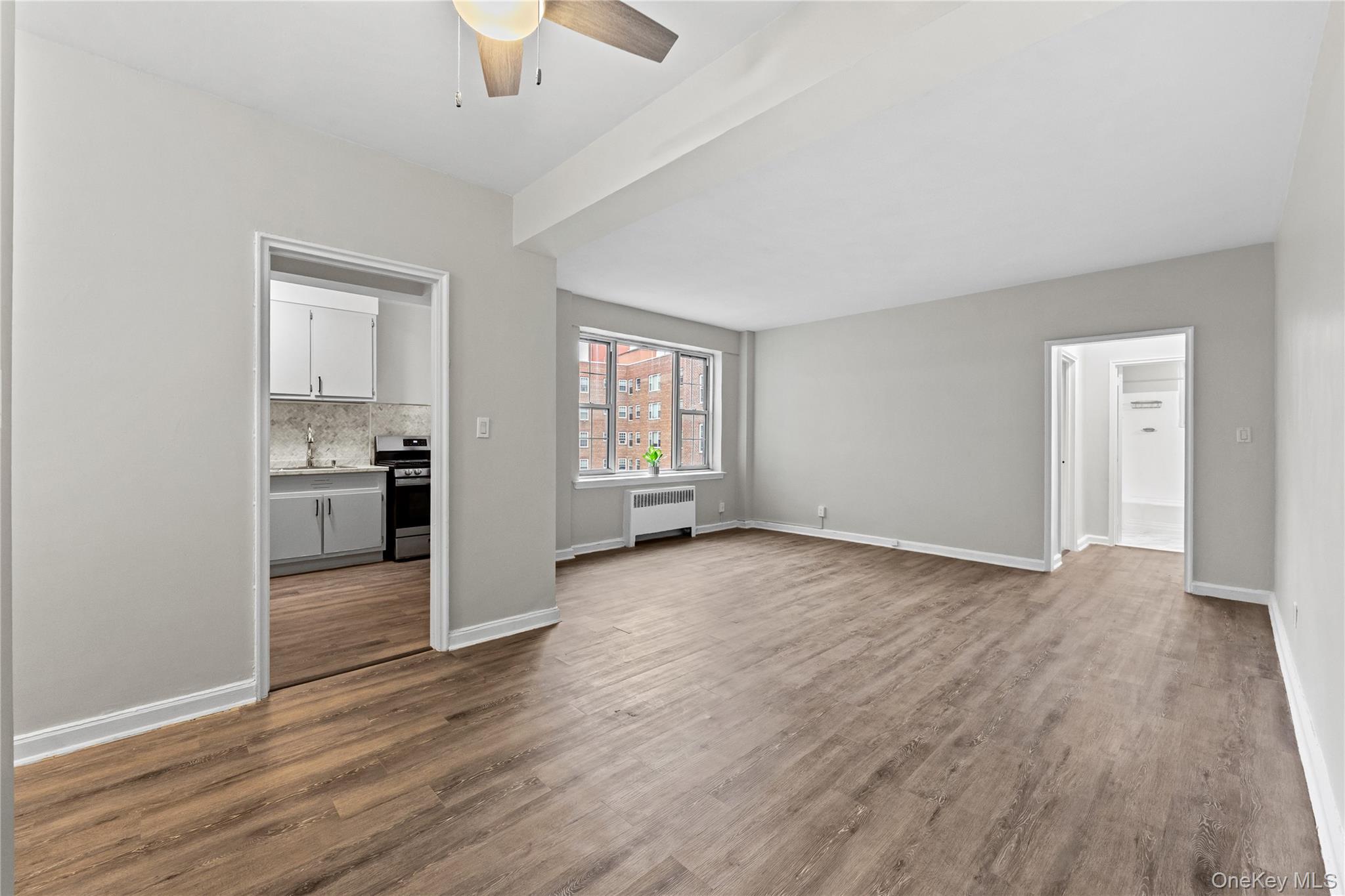 230 Pelham Road, Unit 4L New Rochelle, NY 10805 - Photo 12 of 30 Unfurnished living room featuring ceiling fan