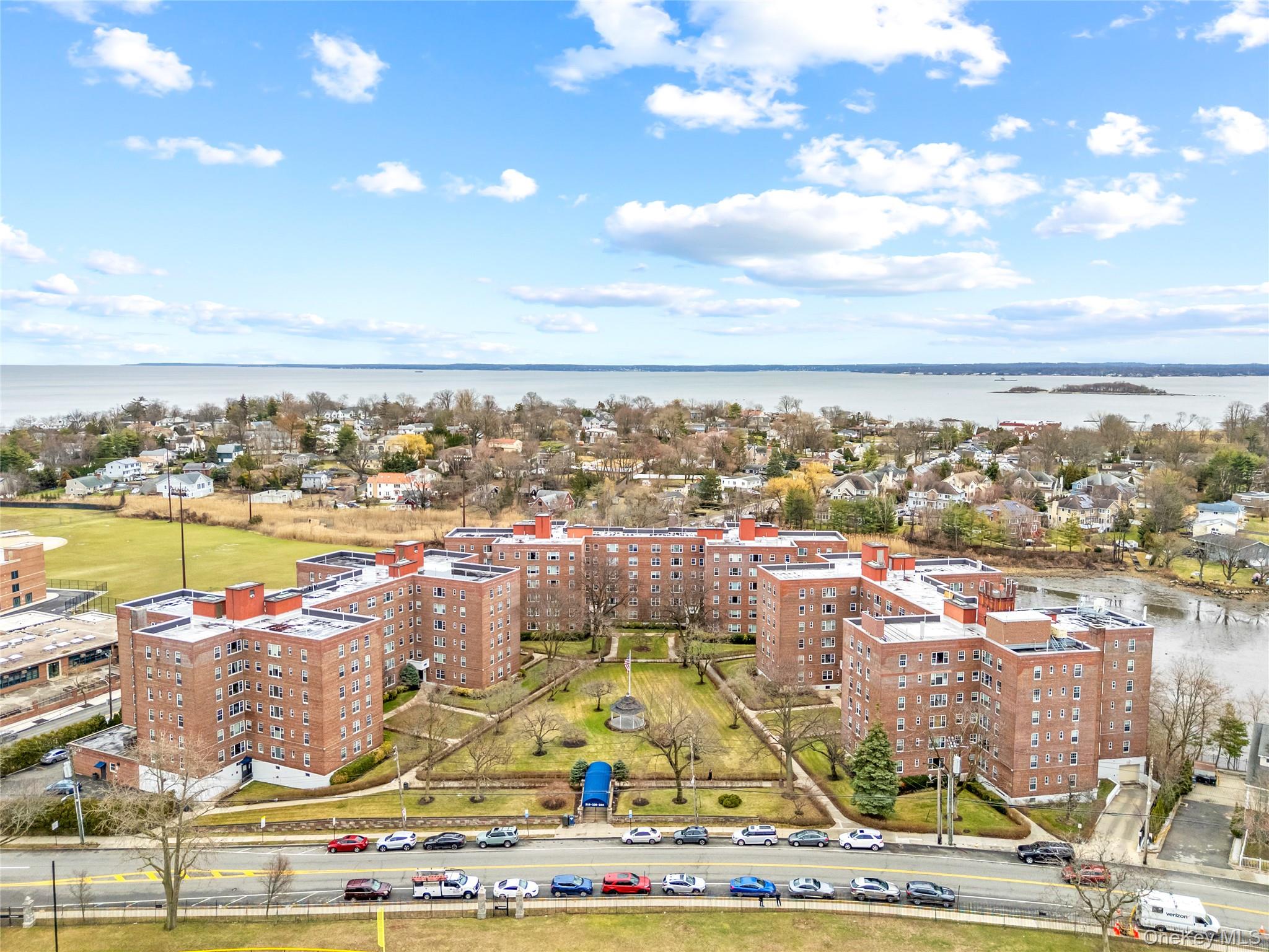 230 Pelham Road, Unit 4L New Rochelle, NY 10805 - Photo 4 of 30 Drone / aerial view of a nearby body of water and apartment complex