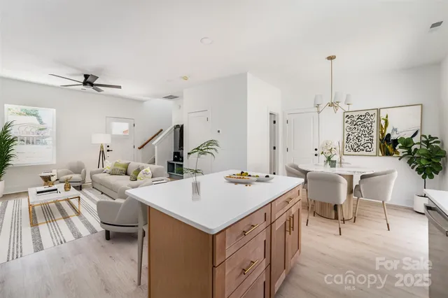 a view of kitchen island a sink and living room