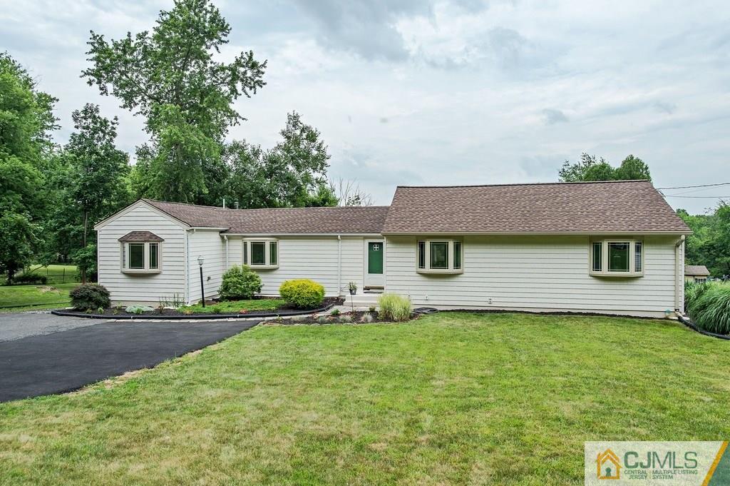 1670 Washington Valley Road Bridgewater, NJ 08836 - Photo 1 of 18 a front view of a house with yard and green space
