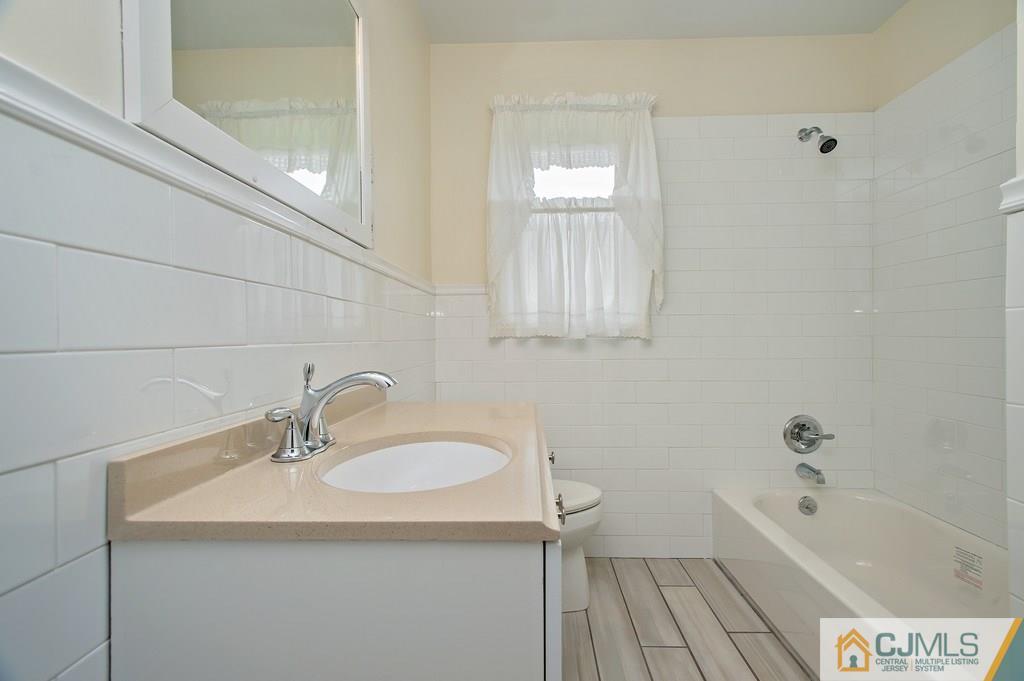 1670 Washington Valley Road Bridgewater, NJ 08836 - Photo 14 of 18 a bathroom with a sink and a bathtub