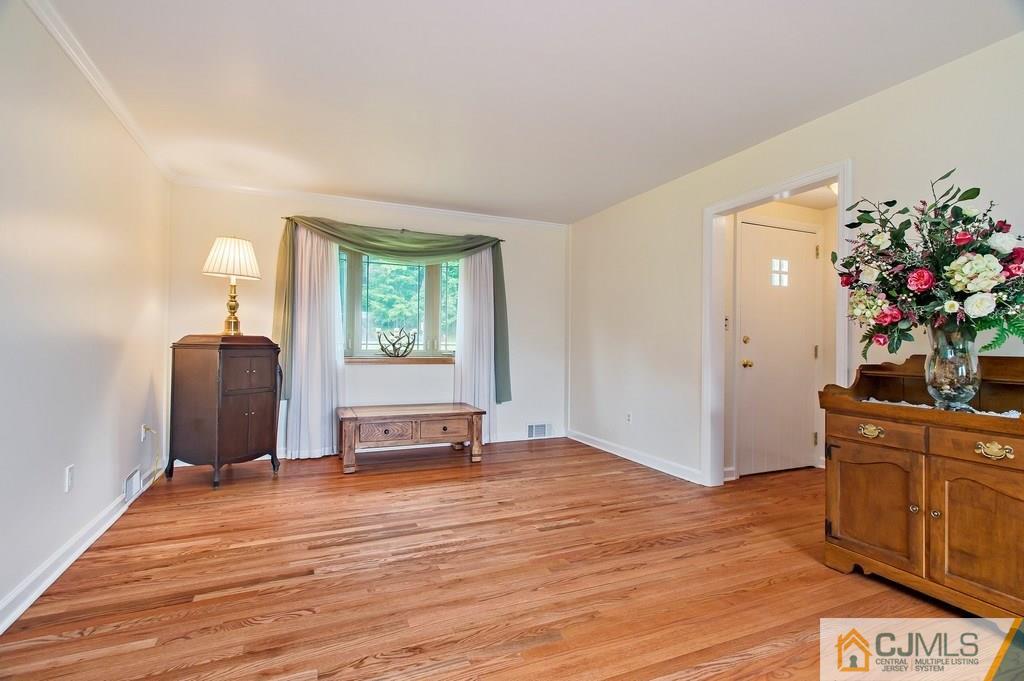1670 Washington Valley Road Bridgewater, NJ 08836 - Photo 15 of 18 a view of a livingroom with wooden floor and furniture