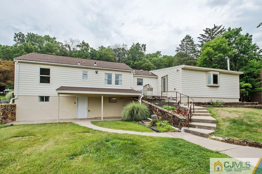 1670 Washington Valley Road Bridgewater, NJ 08836 - Photo 17 of 18 a view of a house with backyard