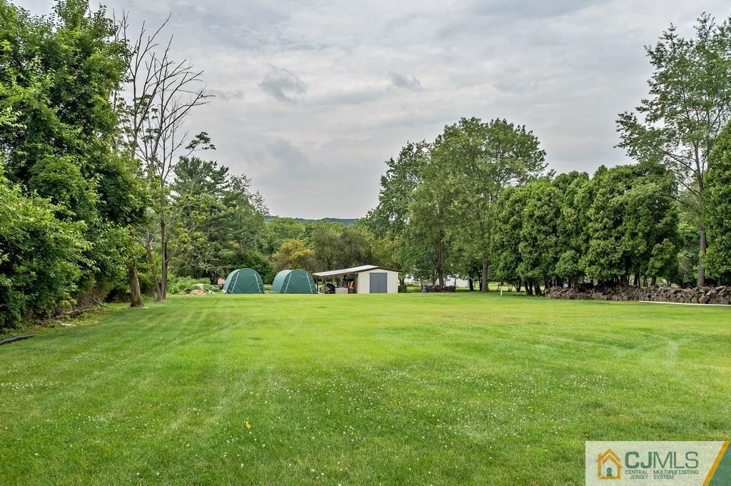 1670 Washington Valley Road Bridgewater, NJ 08836 - Photo 18 of 18 a view of a big yard with plants and large trees