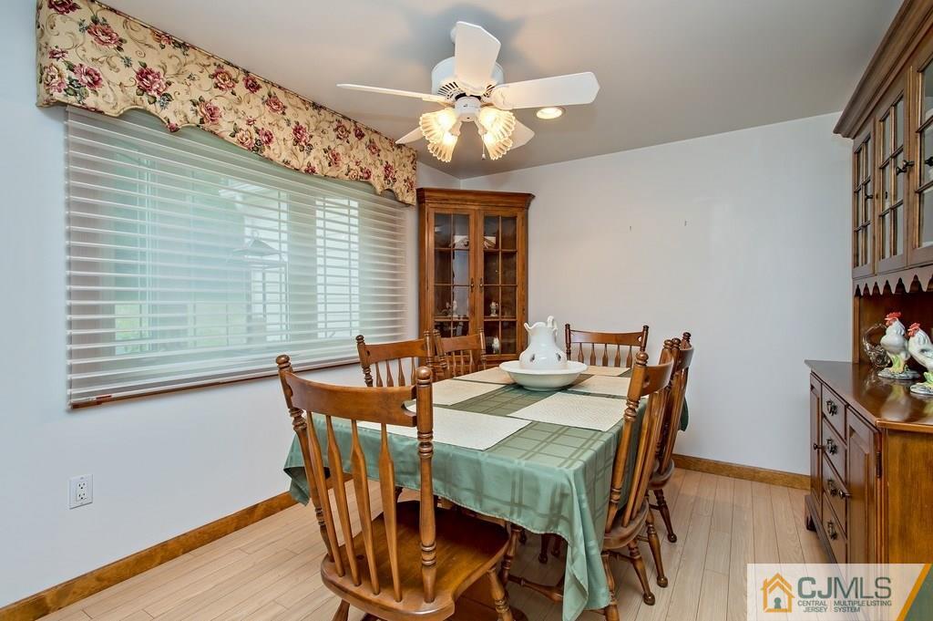 1670 Washington Valley Road Bridgewater, NJ 08836 - Photo 6 of 18 a view of a dining room with furniture and chandelier