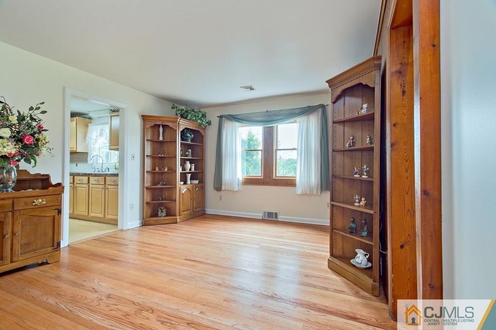 1670 Washington Valley Road Bridgewater, NJ 08836 - Photo 7 of 18 a view of an empty room with kitchen and window