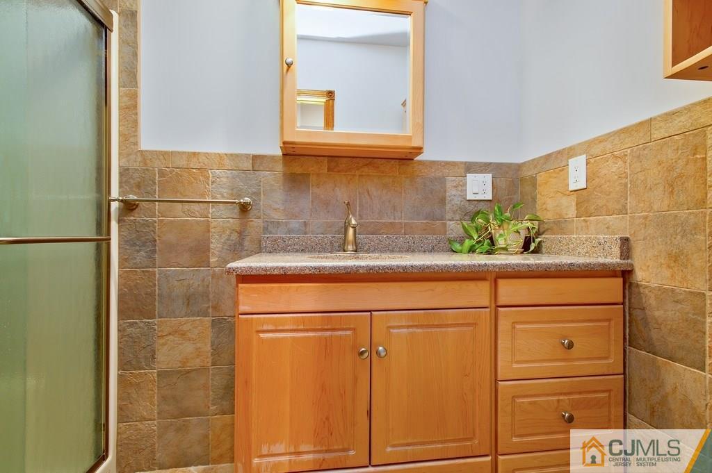 1670 Washington Valley Road Bridgewater, NJ 08836 - Photo 10 of 18 a bathroom with a sink and a mirror