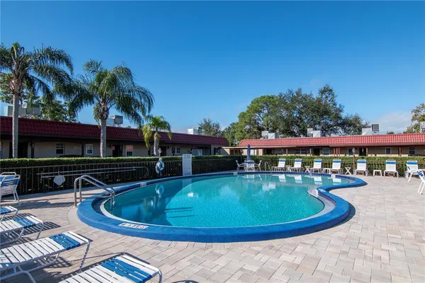 a view of a swimming pool with a patio