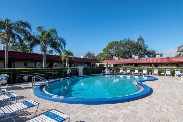 a view of a swimming pool with a patio