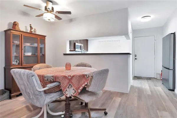 a view of a dining room with furniture and wooden floor
