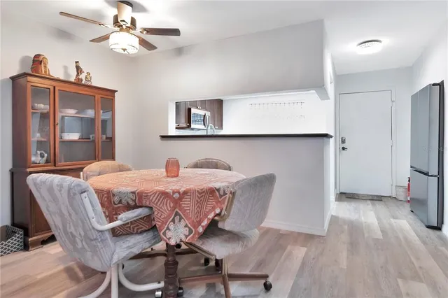 a view of a dining room with furniture and wooden floor
