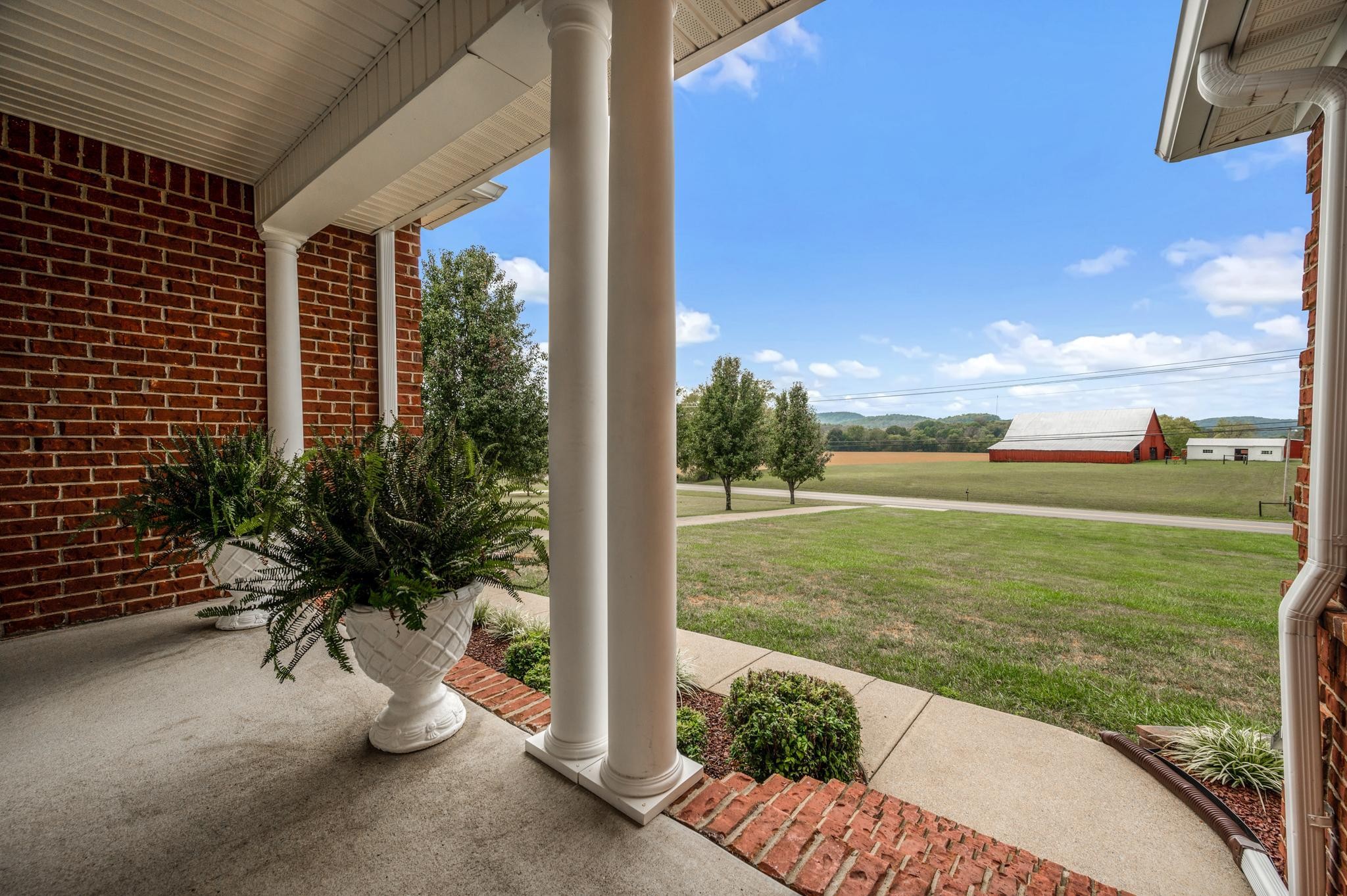 633 Bradyville Road Woodbury, TN 37190 - Photo 15 of 49 a view of a porch with a garden