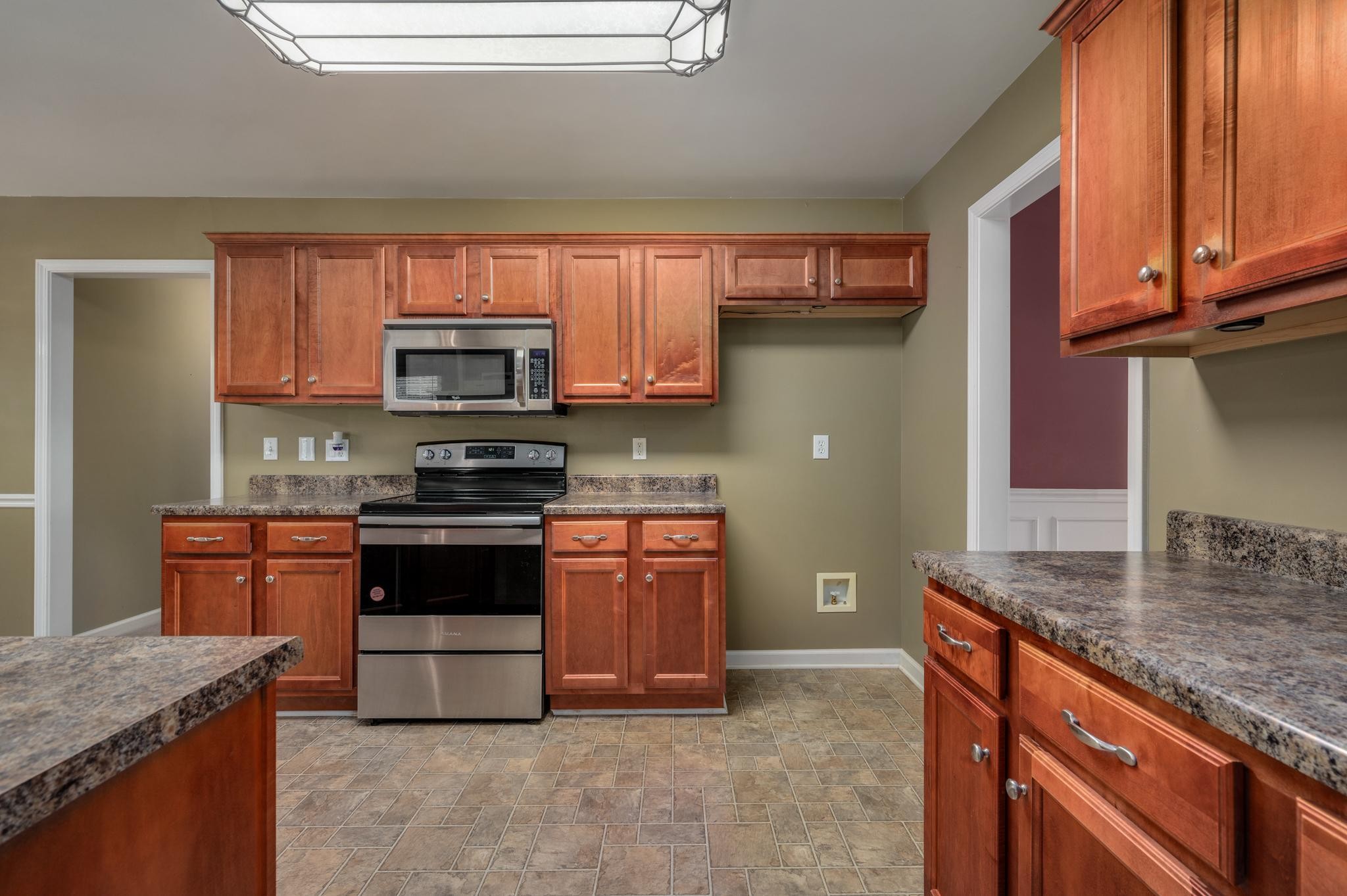 633 Bradyville Road Woodbury, TN 37190 - Photo 5 of 49 a kitchen with stainless steel appliances granite countertop a stove sink and cabinets