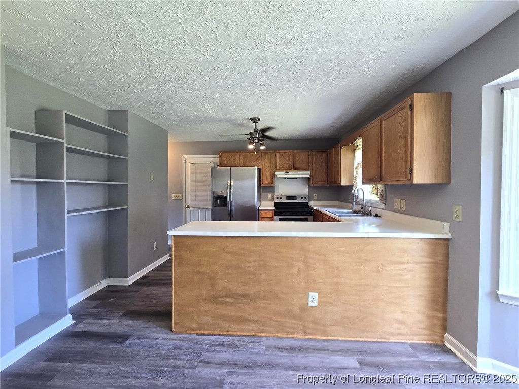 7132 Dayspring Drive Fayetteville, NC 28314 - Photo 14 of 44 a view of kitchen with stainless steel appliances granite countertop sink and wooden floor