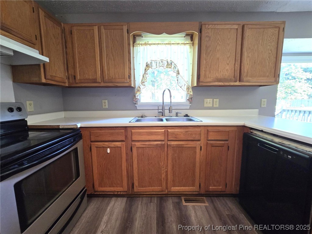 7132 Dayspring Drive Fayetteville, NC 28314 - Photo 19 of 44 a kitchen with sink cabinets and window
