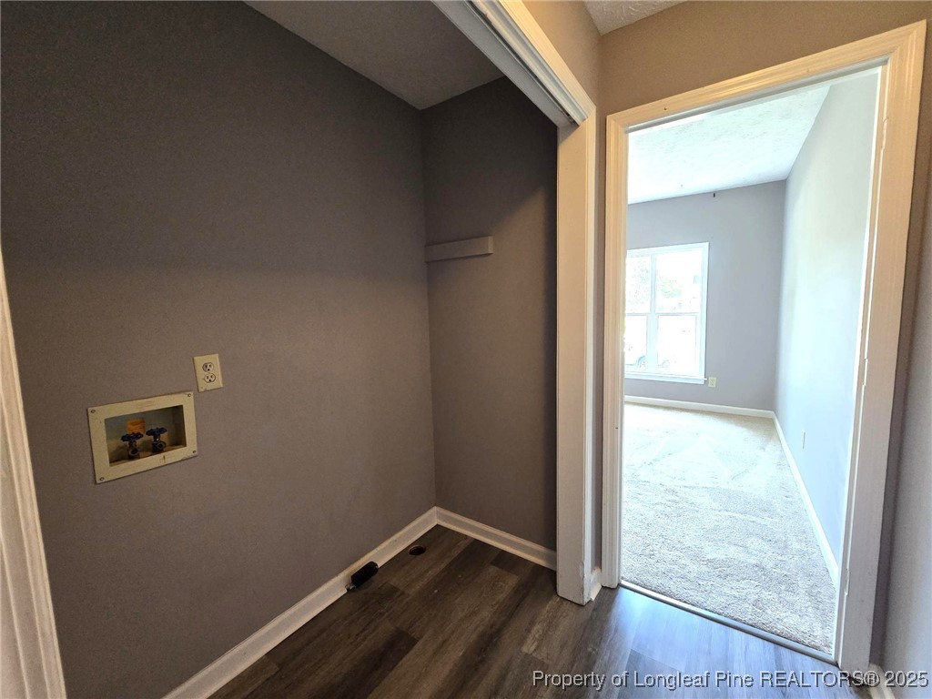 7132 Dayspring Drive Fayetteville, NC 28314 - Photo 20 of 44 an empty room with wooden floor and windows