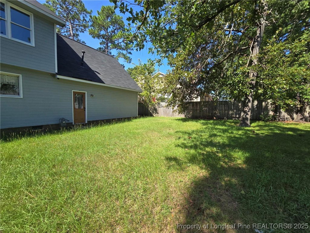 7132 Dayspring Drive Fayetteville, NC 28314 - Photo 25 of 44 a backyard of a house with lots of green space