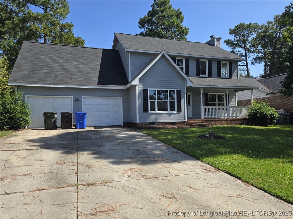 7132 Dayspring Drive Fayetteville, NC 28314 - Photo 3 of 44 a front view of a house with a garden