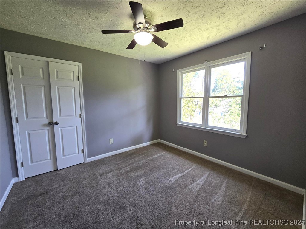 7132 Dayspring Drive Fayetteville, NC 28314 - Photo 38 of 44 an empty room with fan and windows