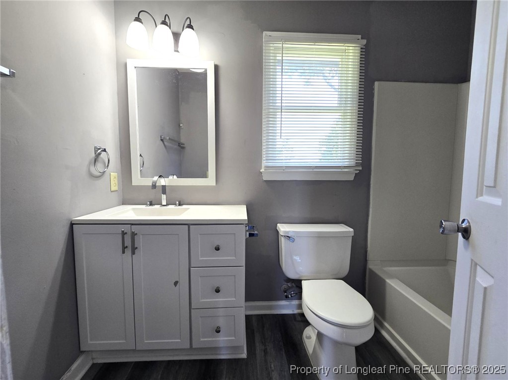 7132 Dayspring Drive Fayetteville, NC 28314 - Photo 39 of 44 a bathroom with a toilet sink and mirror