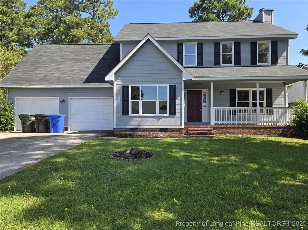 7132 Dayspring Drive Fayetteville, NC 28314 - Photo 4 of 44 a front view of a house with a yard