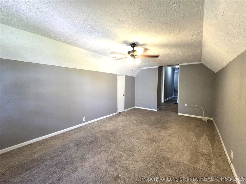 7132 Dayspring Drive Fayetteville, NC 28314 - Photo 44 of 44 a view of an empty room with a chandelier fan