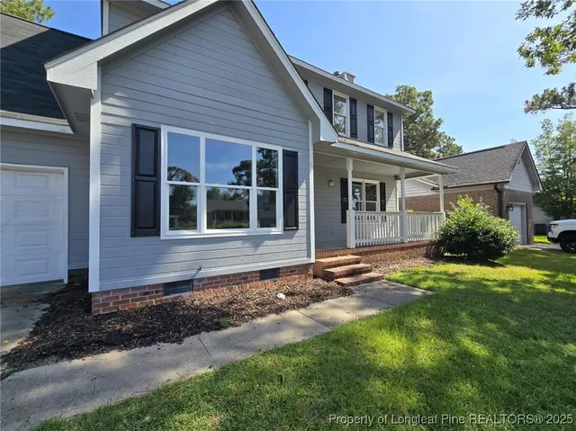 a house with trees in the background