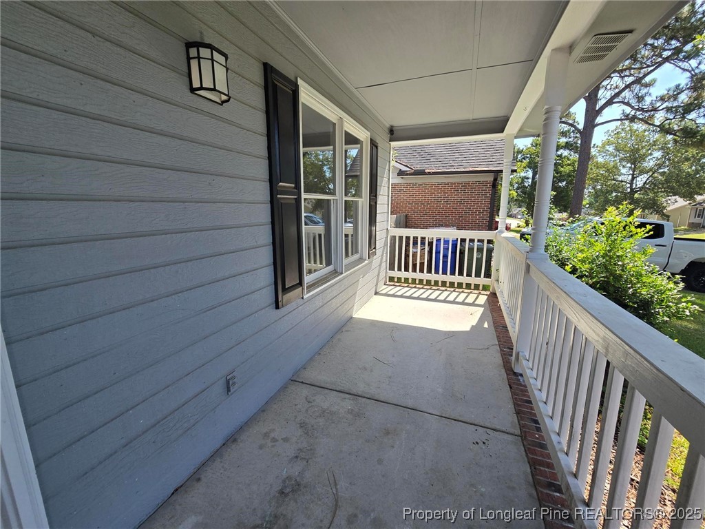 7132 Dayspring Drive Fayetteville, NC 28314 - Photo 7 of 44 a view of porch with wooden floor