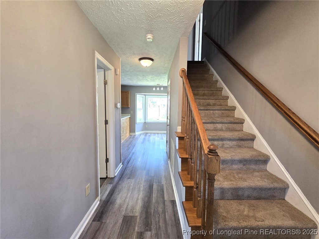 7132 Dayspring Drive Fayetteville, NC 28314 - Photo 8 of 44 a view of entryway and gallery with wooden floor
