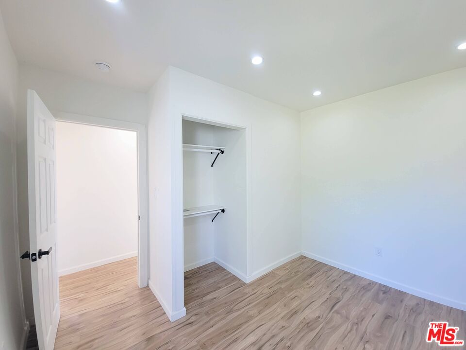 200 North Acacia Avenue Compton, CA 90220 - Photo 12 of 18 a view of an empty room with wooden floor