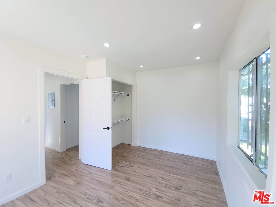 200 North Acacia Avenue Compton, CA 90220 - Photo 15 of 18 a view of hallway with wooden floor