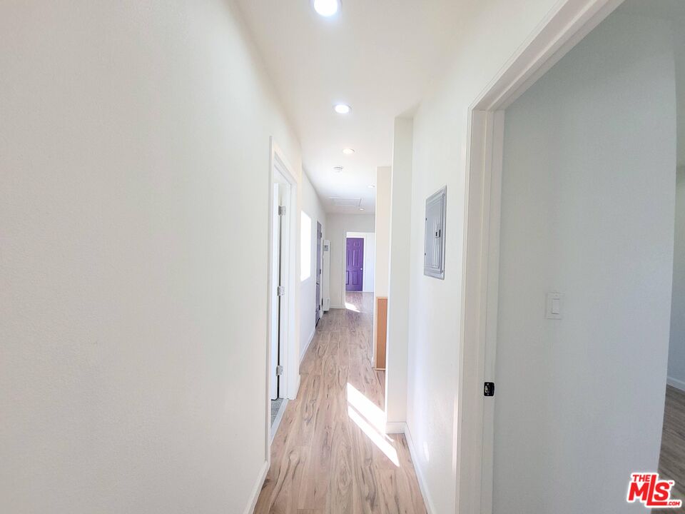 200 North Acacia Avenue Compton, CA 90220 - Photo 17 of 18 a view of a hallway with wooden floor