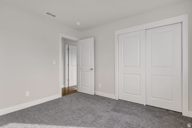 578 West 7th Midvale, UT 84047 - Photo 23 of 35 Unfurnished bedroom featuring carpet flooring and a closet
