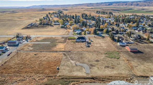 an aerial view of residential building and ocean view