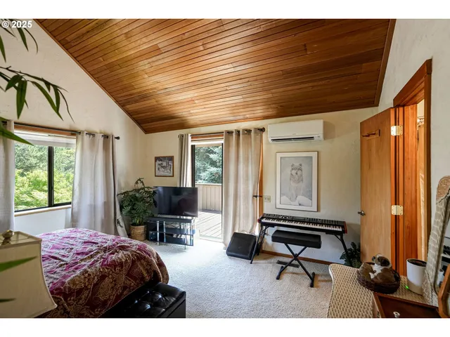 a bedroom with furniture and a window