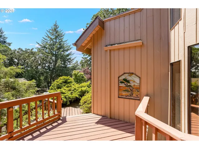 a view of balcony with wooden floor