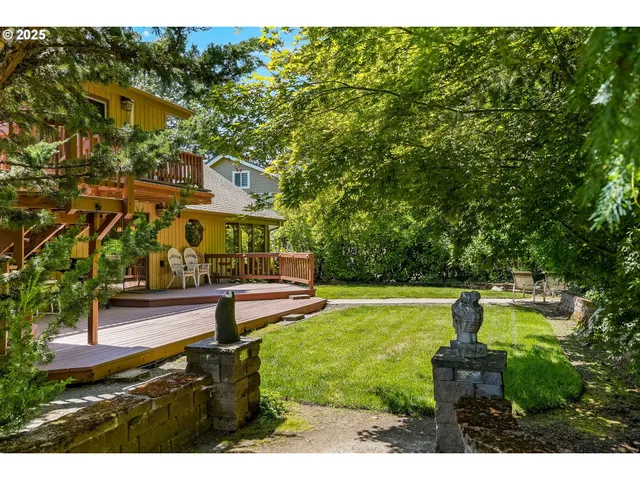 a swimming pool with outdoor seating and yard