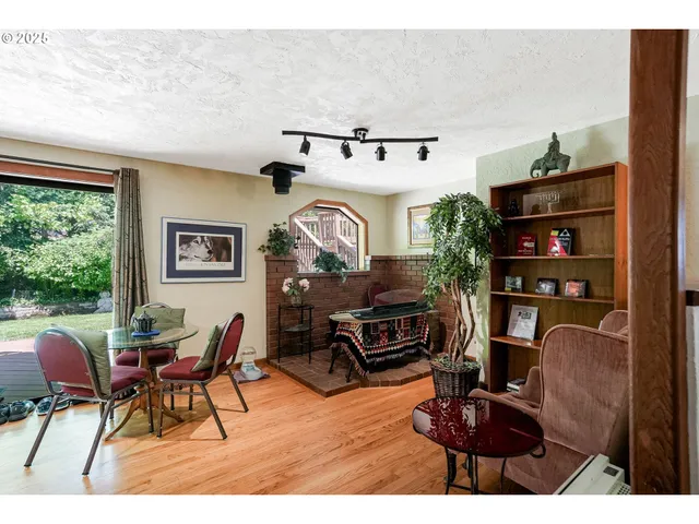 a workspace with furniture window and wooden floor