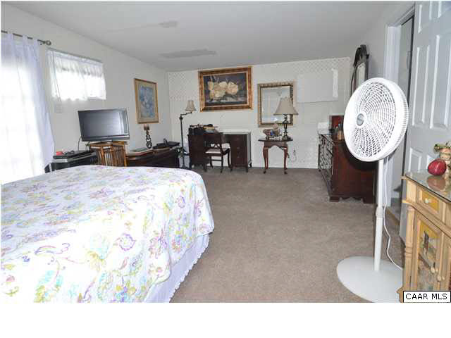 3425 Richmond Road Keswick, VA 22947 - Photo 17 of 22 a living room with furniture a window and a fireplace