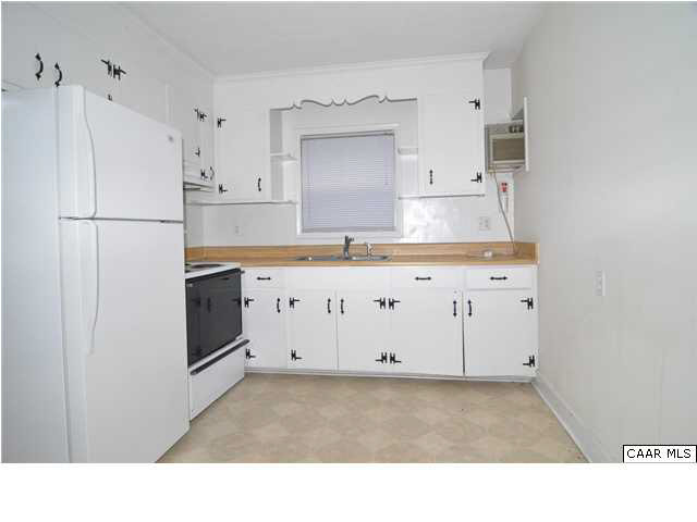 3425 Richmond Road Keswick, VA 22947 - Photo 3 of 22 a kitchen with granite countertop a white refrigerator oven a sink and white cabinets