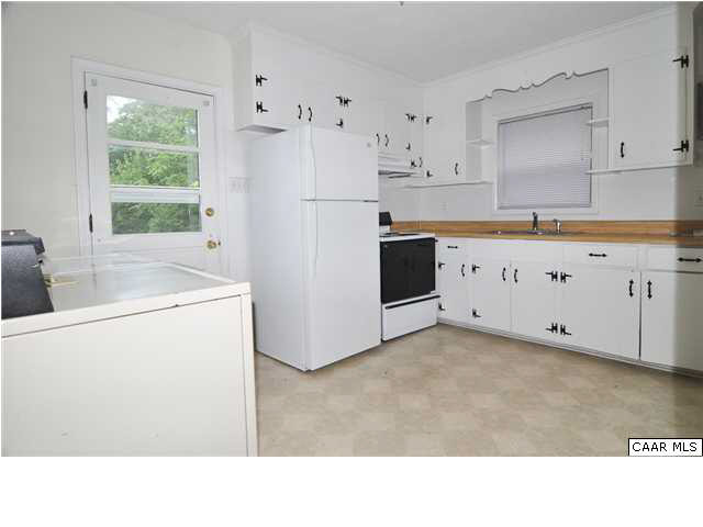 3425 Richmond Road Keswick, VA 22947 - Photo 4 of 22 a kitchen with stainless steel appliances a refrigerator sink and cabinets