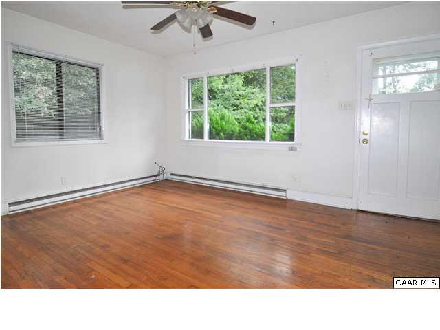 3425 Richmond Road Keswick, VA 22947 - Photo 5 of 22 a room with wooden floor and windows