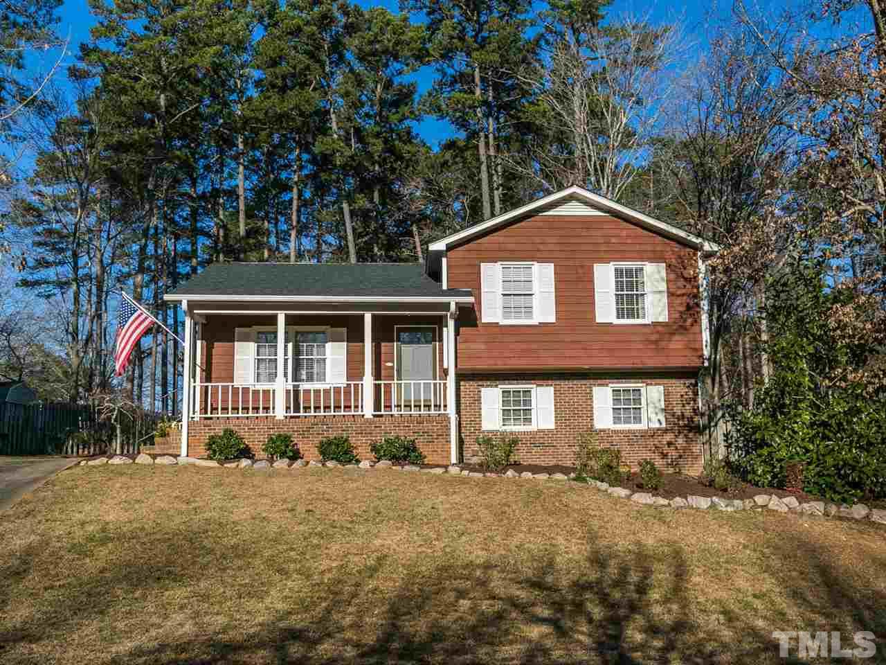 7705 Prospector Place Raleigh, NC 27615 - Photo 1 of 30 a front view of a house with a garden