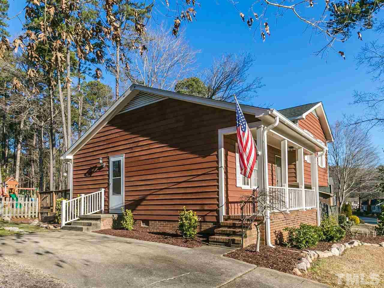 7705 Prospector Place Raleigh, NC 27615 - Photo 2 of 30 a front view of a house with a yard