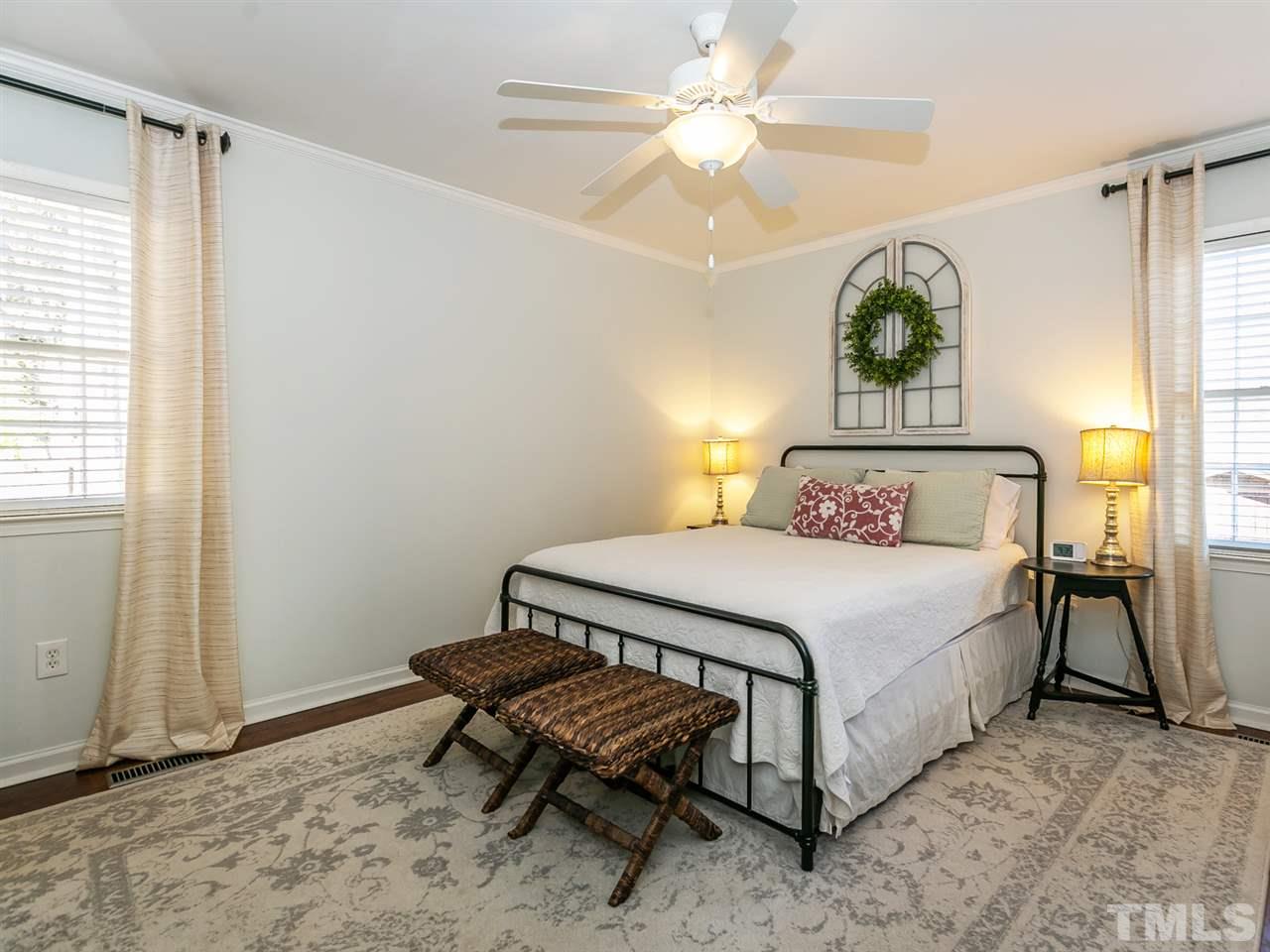 7705 Prospector Place Raleigh, NC 27615 - Photo 13 of 30 a bedroom with a bed and a window
