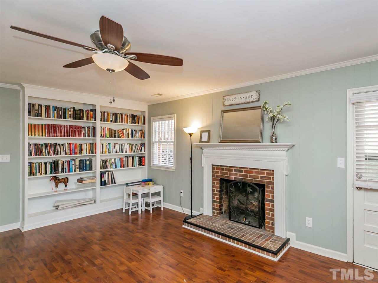 7705 Prospector Place Raleigh, NC 27615 - Photo 16 of 30 a living room with furniture and a fireplace